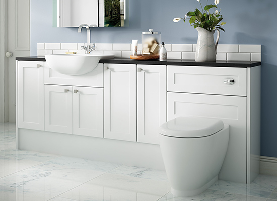 traditional toilet and sink within a luxury fitted bathroom 